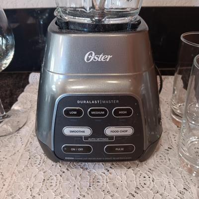 OSTER BLENDER, 6 TUMBLERS AND 2 STEMMED GLASSES