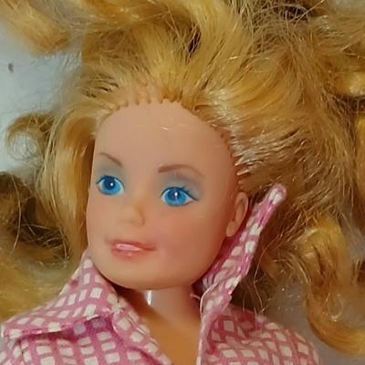 Four 1960's barbie dolls with clothes