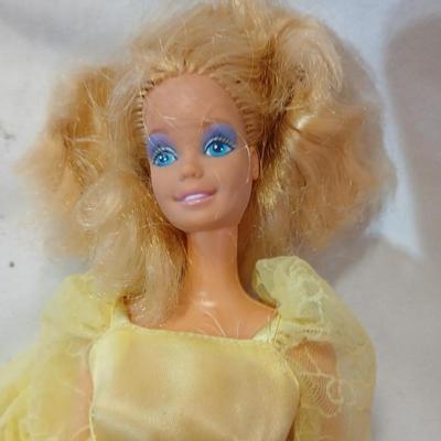 Four 1960's barbie dolls with clothes