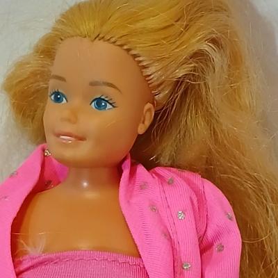 Four 1960's barbie dolls with clothes