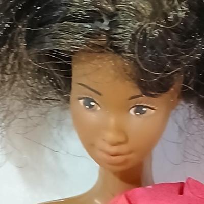 Four 1960's barbie dolls with clothes