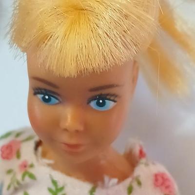 Four 1960's barbie dolls with clothes