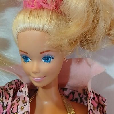 Four 1960's barbie dolls with clothes