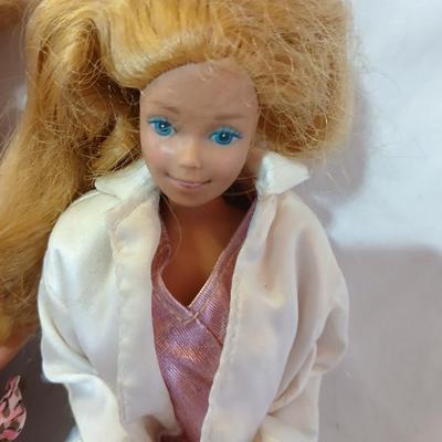 Four 1960's barbie dolls with clothes