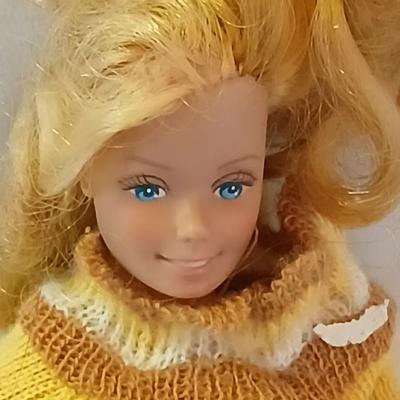 Four 1960's barbie dolls with clothes
