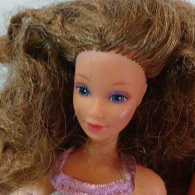 Four 1960's barbie dolls with clothes