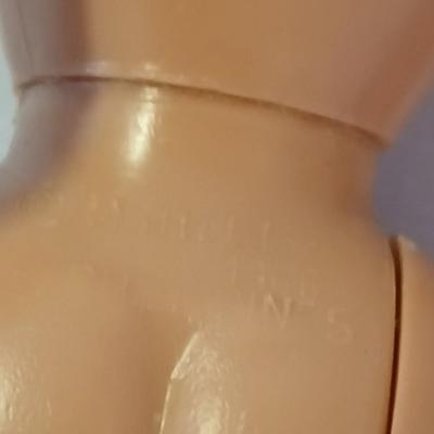 Four 1960's barbie dolls with clothes