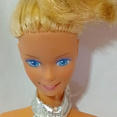 Four 1960's barbie dolls with clothes