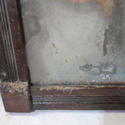 Antique picture frame with wagon wheel lamp