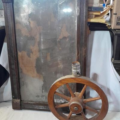 Antique picture frame with wagon wheel lamp