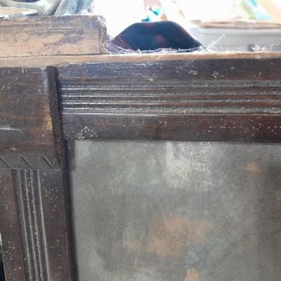 Antique picture frame with wagon wheel lamp