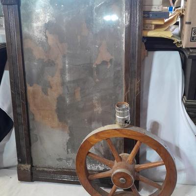 Antique picture frame with wagon wheel lamp