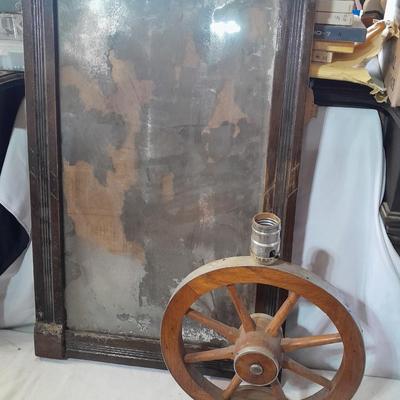 Antique picture frame with wagon wheel lamp
