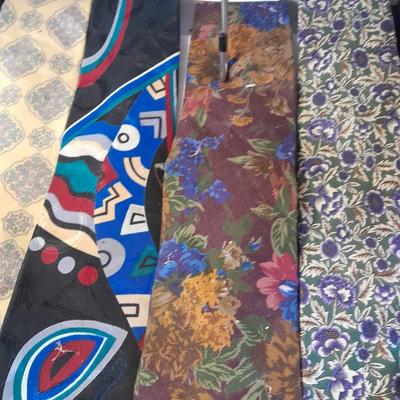 Ten neck ties and a hanger for them