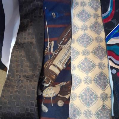 Ten neck ties and a hanger for them