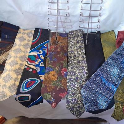 Ten neck ties and a hanger for them