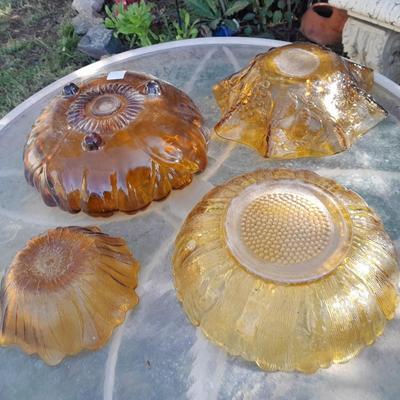 Amber glass bowls - Pedestal bowl and flower shape pressed glass