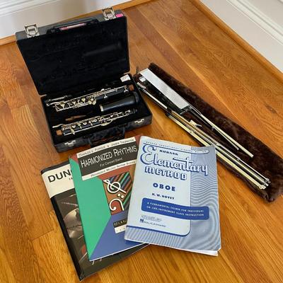 Oboe, Metal Music Stand, and Music Books