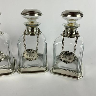 677 Set of Four Glass/Pewter Decanters w/ tags