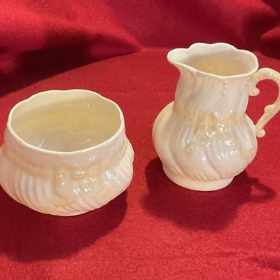 Belleek China from Ireland, cream colored with a yellow bow