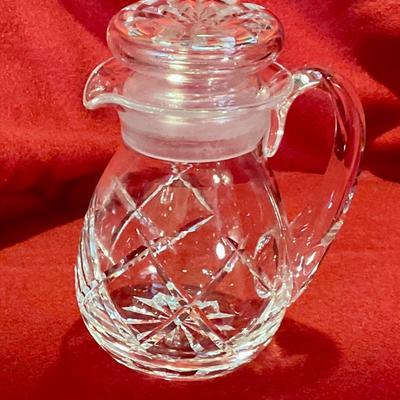 Covered cut glass cream pitcher, no mark found