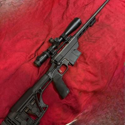 Savage 6.5 × .284 Norma in a MDT Chassis witg Luth AR Buttstock and a Vortex Cantilever Mount with Vortex Ammo