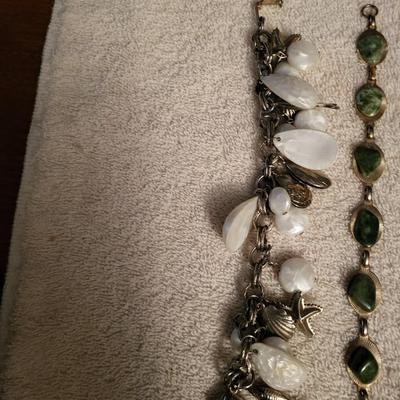 VARIETY OF BRACELETS AND A SHOE CLIP