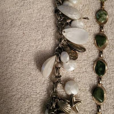 VARIETY OF BRACELETS AND A SHOE CLIP
