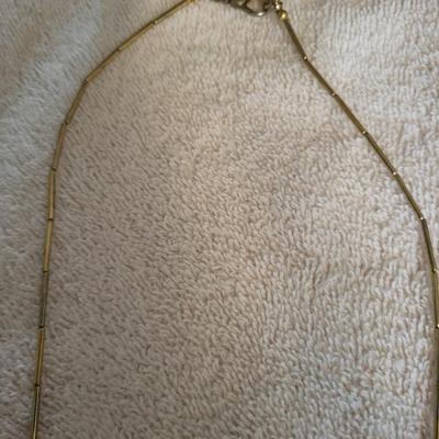 2 NECKLACES AND 2 PAIRS OF CLIP ON EARRINGS