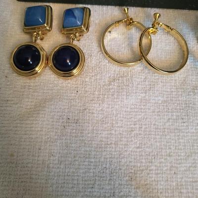 GOLD-TONE CLIP ON EARRINGS AND A HAND BROOCH