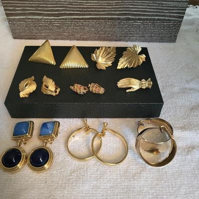 GOLD-TONE CLIP ON EARRINGS AND A HAND BROOCH