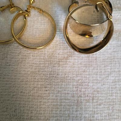 GOLD-TONE CLIP ON EARRINGS AND A HAND BROOCH