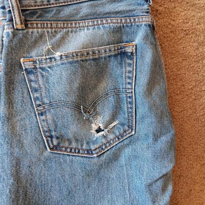 2 PAIRS OF BROKEN IN LEVI JEANS 505 AND A PAIR OF WOOL PANTS