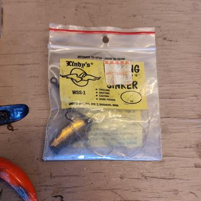 AN ASSORTMENT OF FISHING LURES PLUS MORE