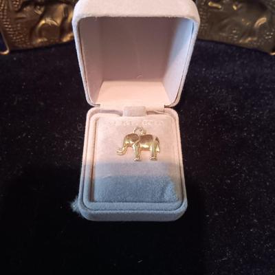 14K ELEPHANT CHARM AND A BRASS ELEPHANT BELT FROM INDIA