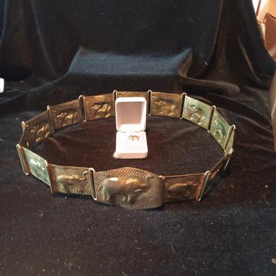 14K ELEPHANT CHARM AND A BRASS ELEPHANT BELT FROM INDIA