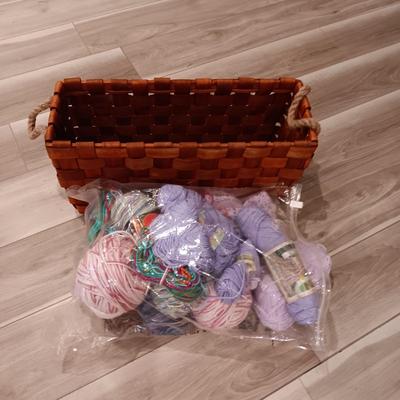 LARGE WEAVED BASKET W/ROPE HANDLES AND SOME YARN