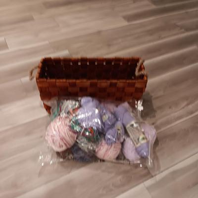 LARGE WEAVED BASKET W/ROPE HANDLES AND SOME YARN