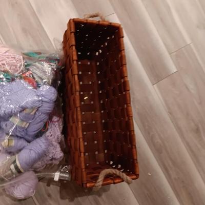 LARGE WEAVED BASKET W/ROPE HANDLES AND SOME YARN