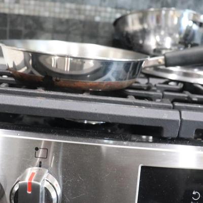 Lot of pots and pans w/ lids