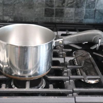 Lot of pots and pans w/ lids