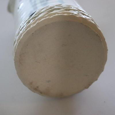 Pottery vase w/ flowers.