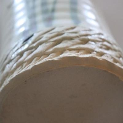 Pottery vase w/ flowers.