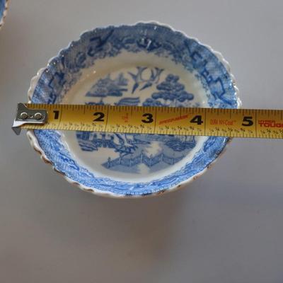 4 small Asian trinket plates with a small tea pot