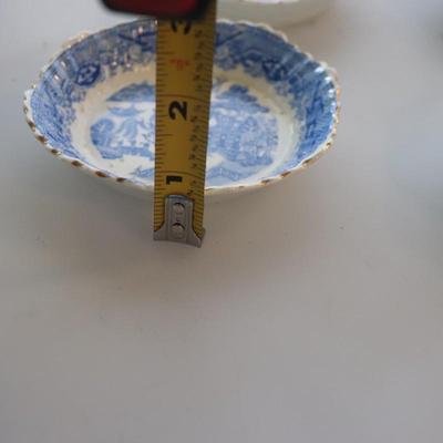 4 small Asian trinket plates with a small tea pot