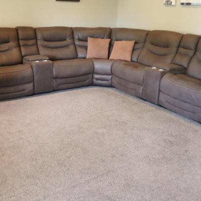 Sectional 3 piece with 6 seater reclining couch. Brown in color.