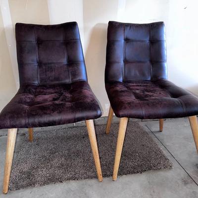 Two armless chairs with wooden legs
