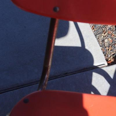 2 orange school-aged chairs