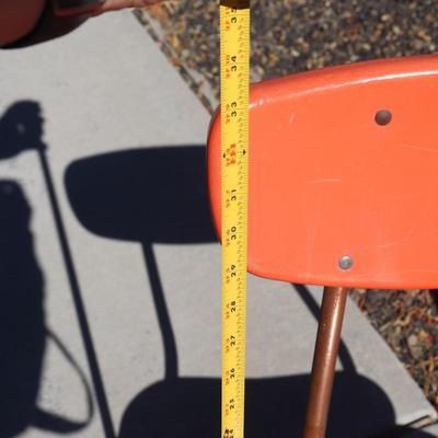 2 orange school-aged chairs