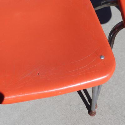 2 orange school-aged chairs